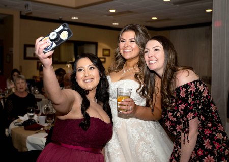 Photo of bride posing with friends by Bill Payne Photography