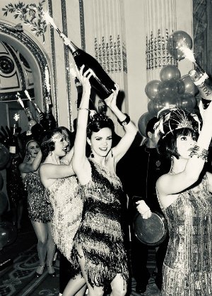 Performers with champagne bottles