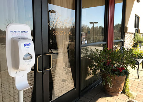 Hand sanitizing station located at the front door of the Foothills