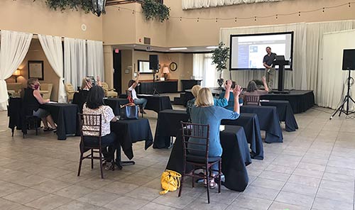 Business seminar at The Foothills Event Center with physically spaced seating